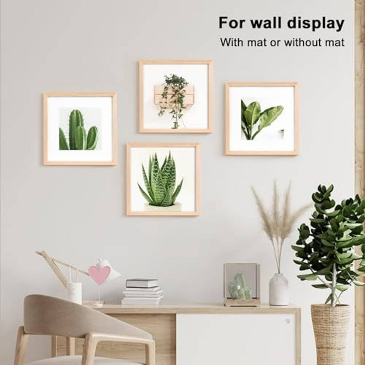 Natural wood square picture frames displayed on a wall with small plant photos and decor