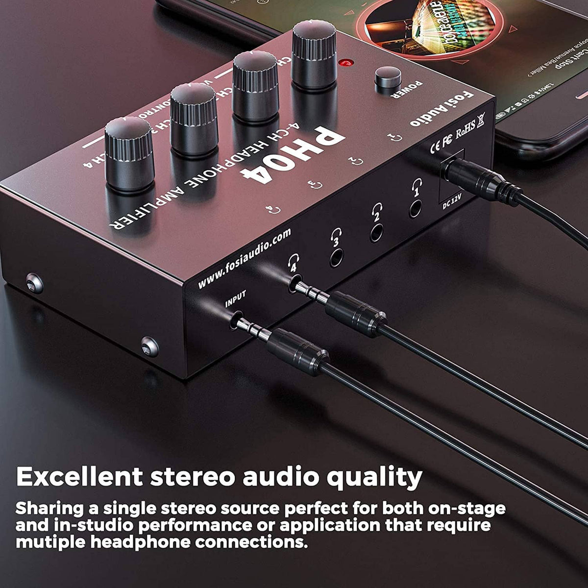 4-channel headphone amplifier with multiple cables plugged into input jacks
