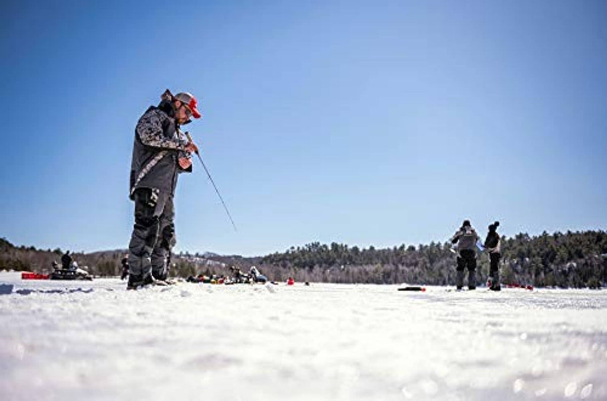 Ice fishing rods with fishing lines cast over a frozen lake