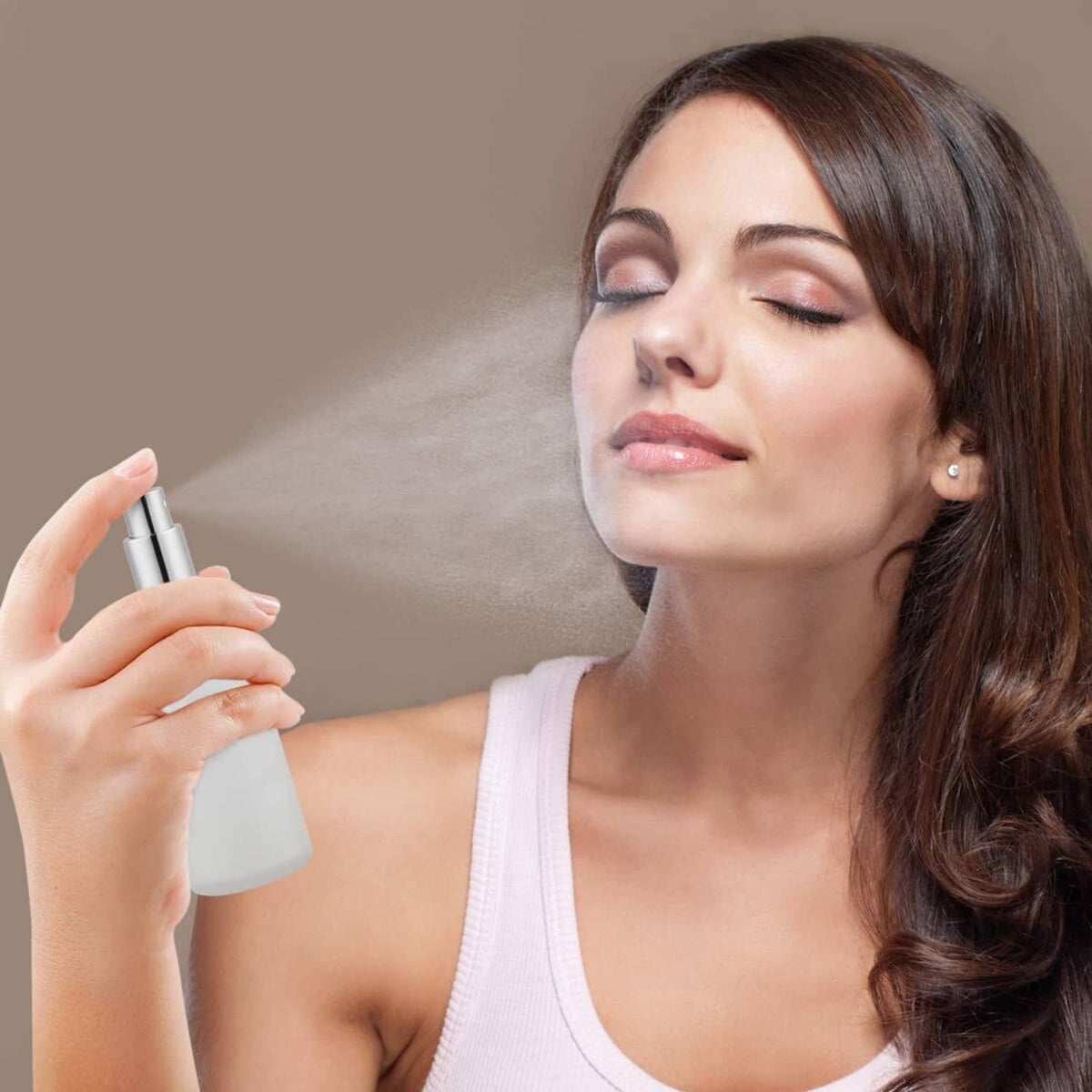 Frosted glass spray bottle with silver pump top, handheld mist sprayer