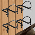 Wall-mounted hat rack set with four black U-bar hooks for cowboy hats