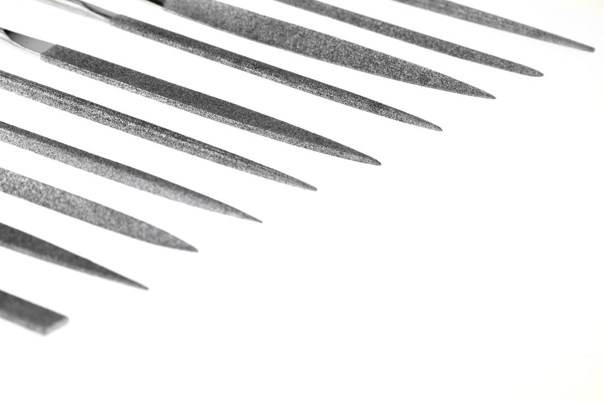 Gray diamond file tips on silver needles with sharp pointed ends