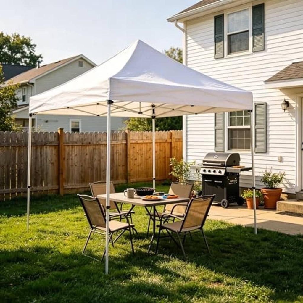 White pop-up canopy replacement top in a backyard over patio tables and chairs