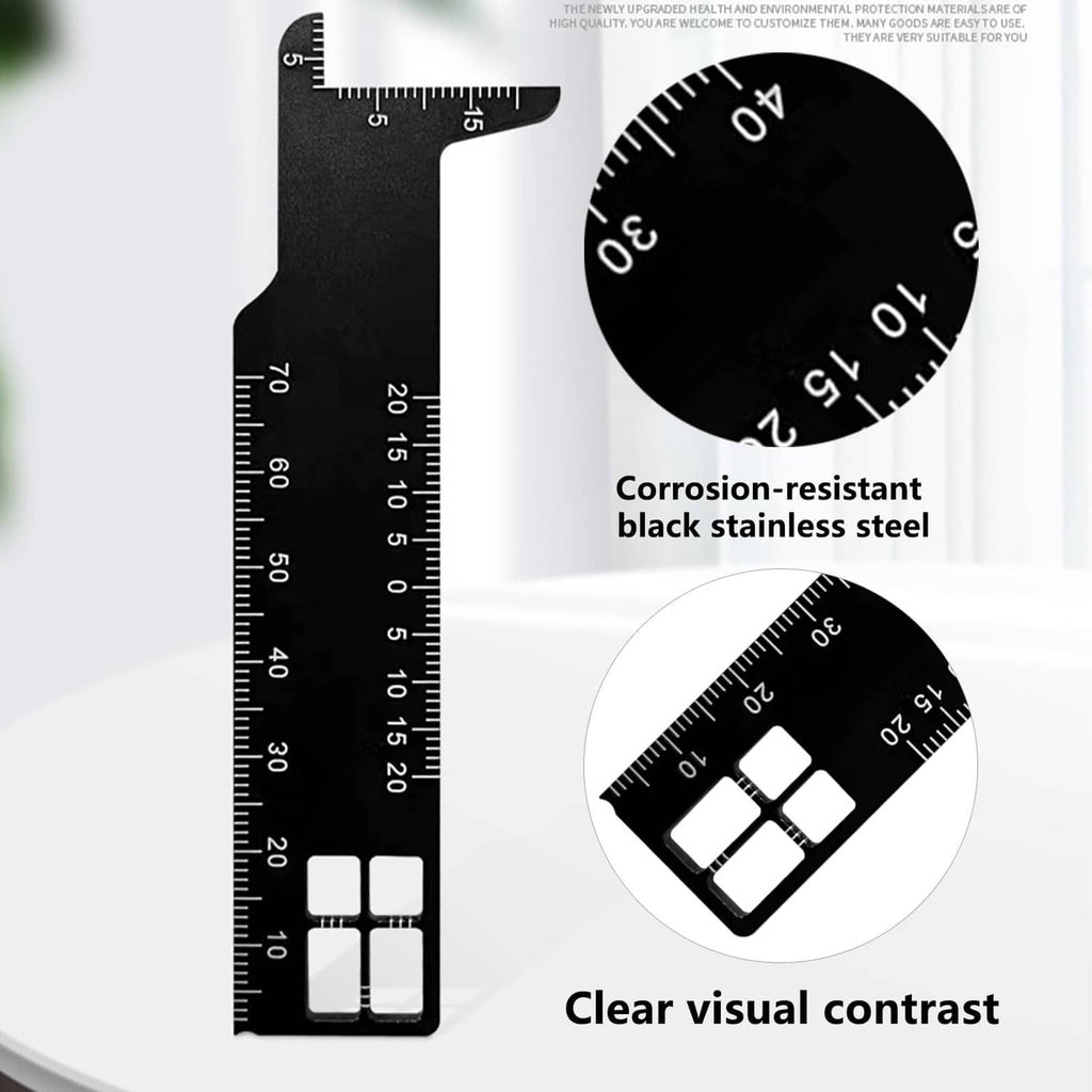 Black stainless steel precision ruler with high-contrast measurement markings and cutouts