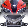 Front upper headlight lamp assembly with clear lens and black trim, chrome reflector housing