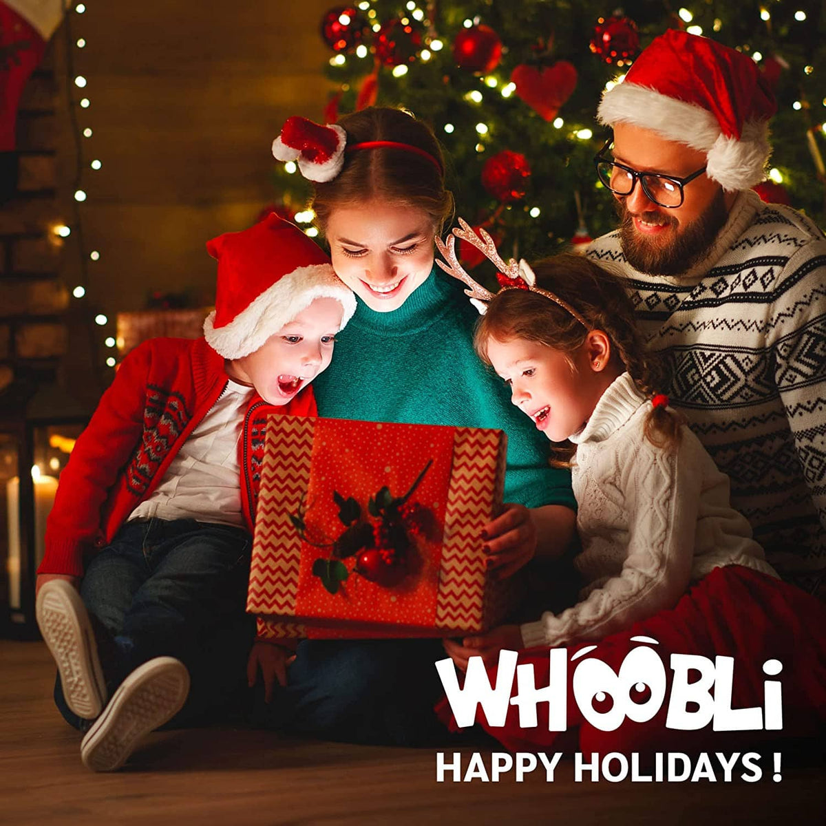 Holiday family holding a boxing-themed gift box