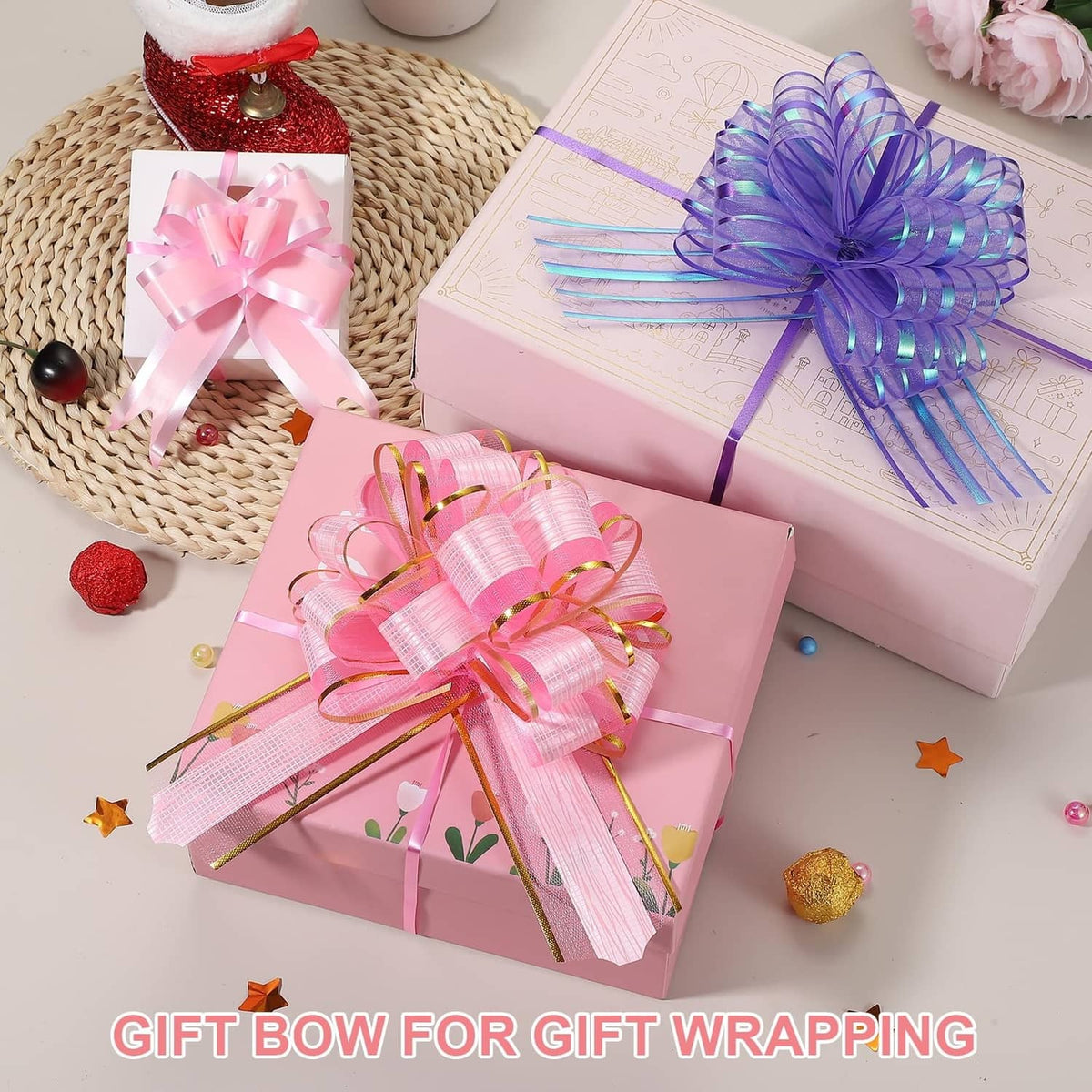 Pink and purple gift bows on wrapped presents, long ribbon tails