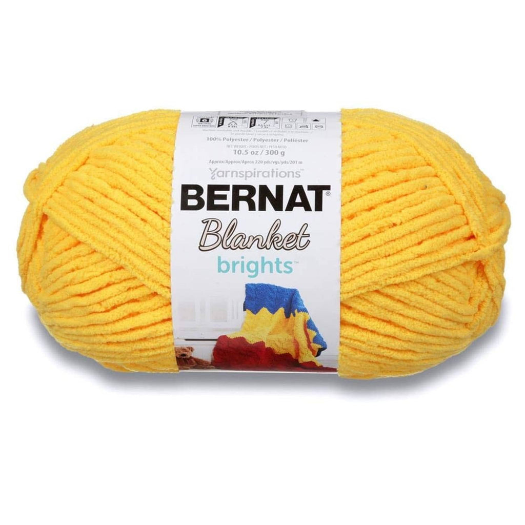 Yellow chenille blanket yarn skein in a tight wound ball, soft plush texture