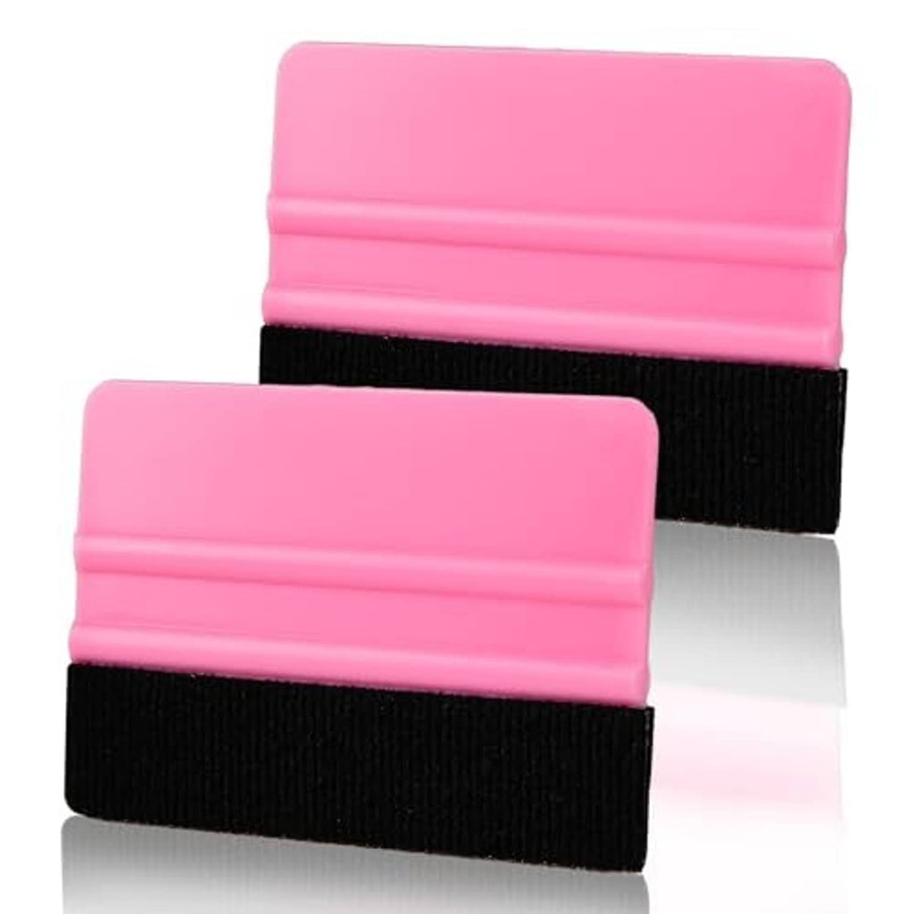 Pink vinyl squeegee tools with black felt pads on plastic handles, front view close-up