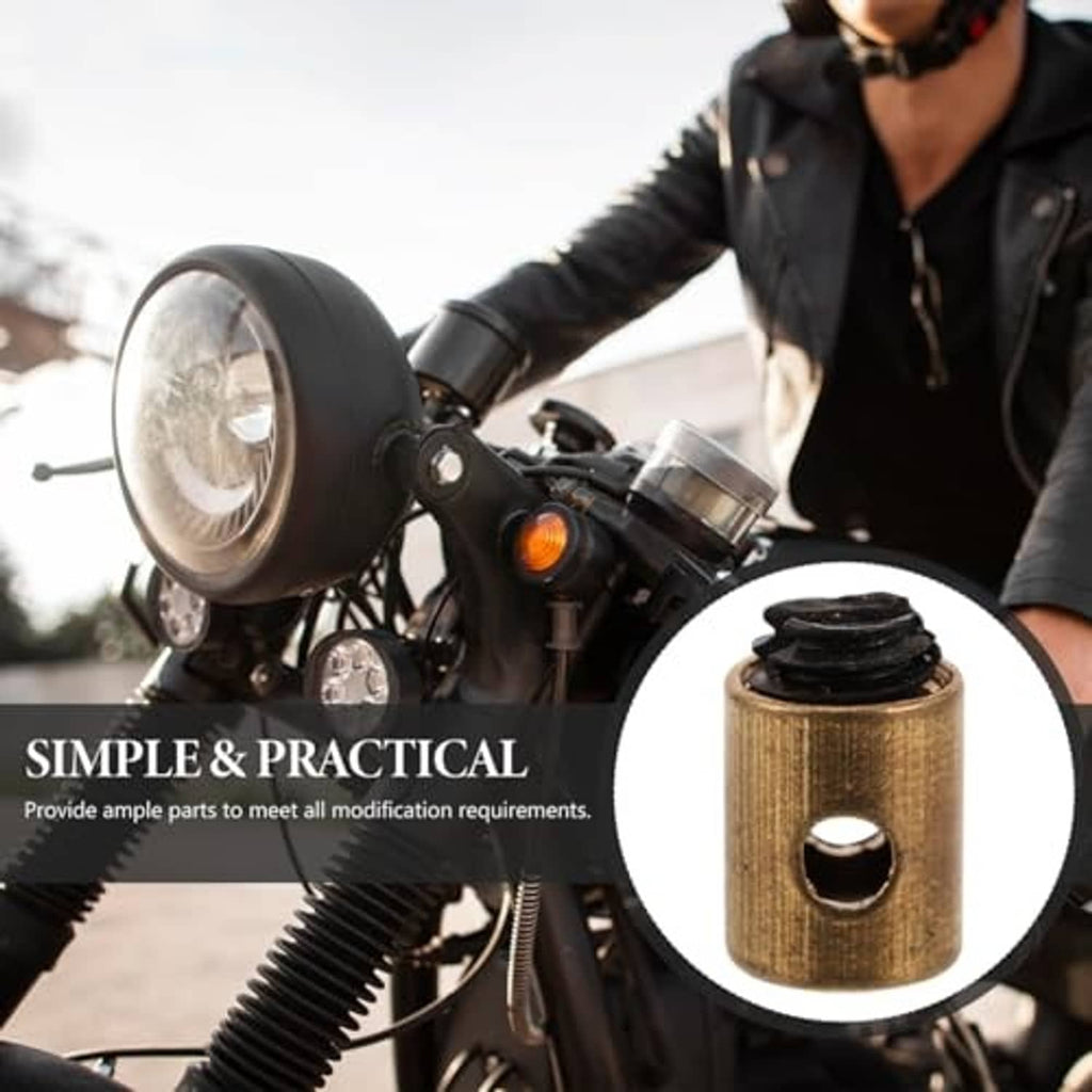 Metal throttle cable nipple close-up: brass body with black rubber boot