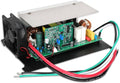 RV power converter with green circuit board, red/green/black wiring, and cooling fan frame.