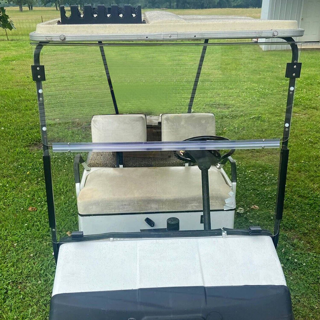 Installed folding windshield with clear panel, blue bar, and black mounting posts