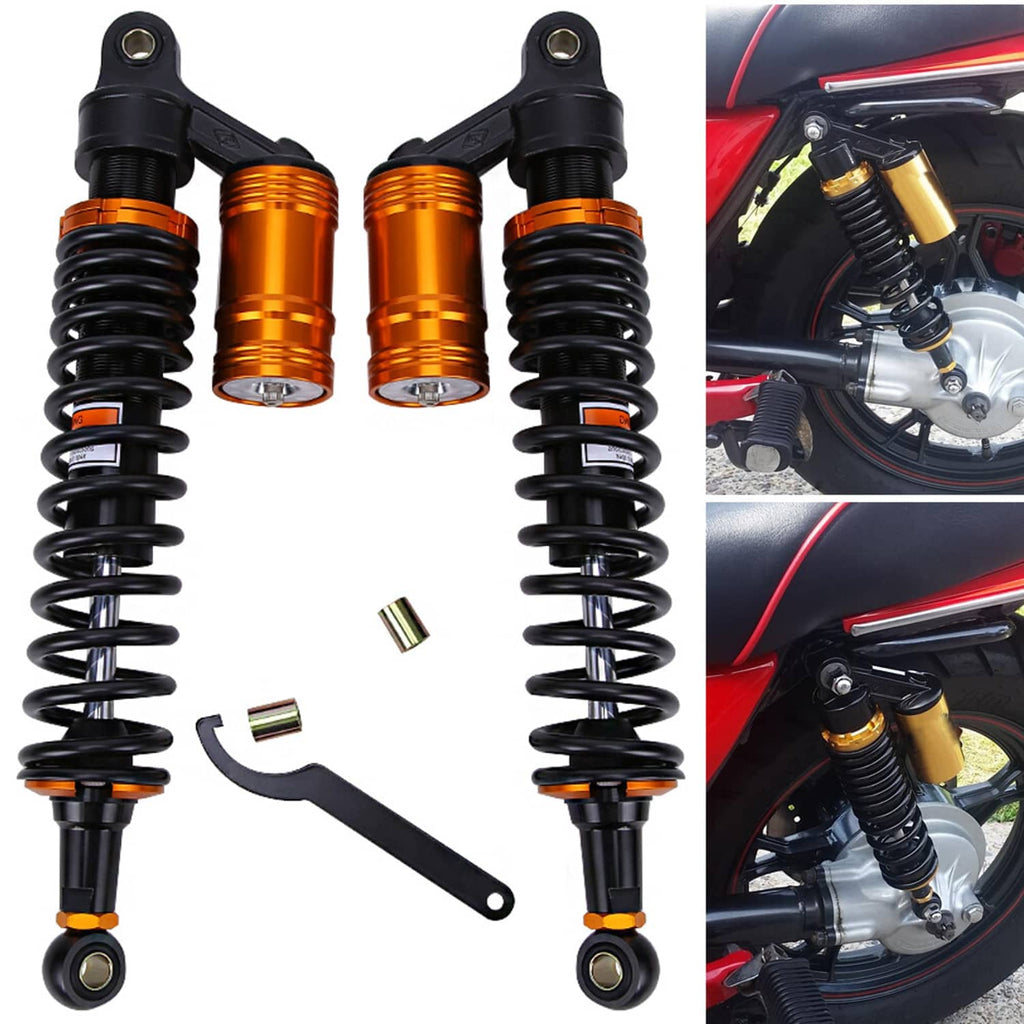 Pair of air shock absorbers, orange-gold cylinders and black springs with clevis mounts
