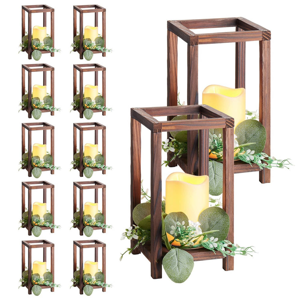 Brown wooden lanterns with LED candles and faux eucalyptus wreath decor