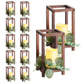 Brown wooden lanterns with LED candles and faux eucalyptus wreath decor