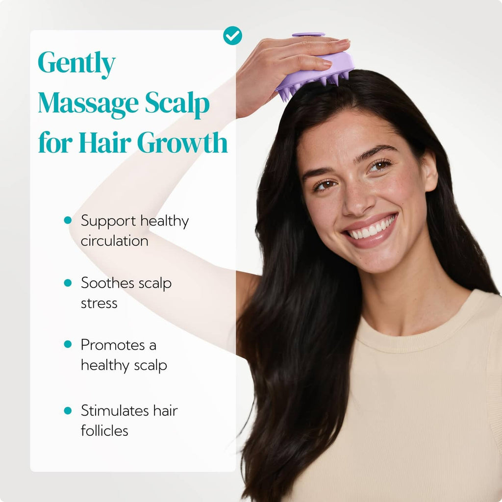 Purple scalp massager brush held against hair and scalp for gentle massage.