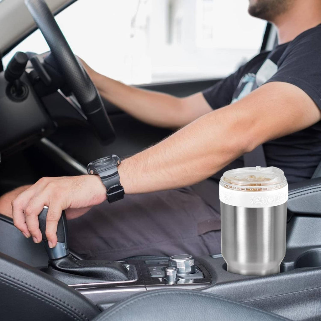 Stainless tumbler with white silicone ring top and black straw