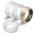 Set of transparent and rose silicone flower ring covers with engraved floral patterns.