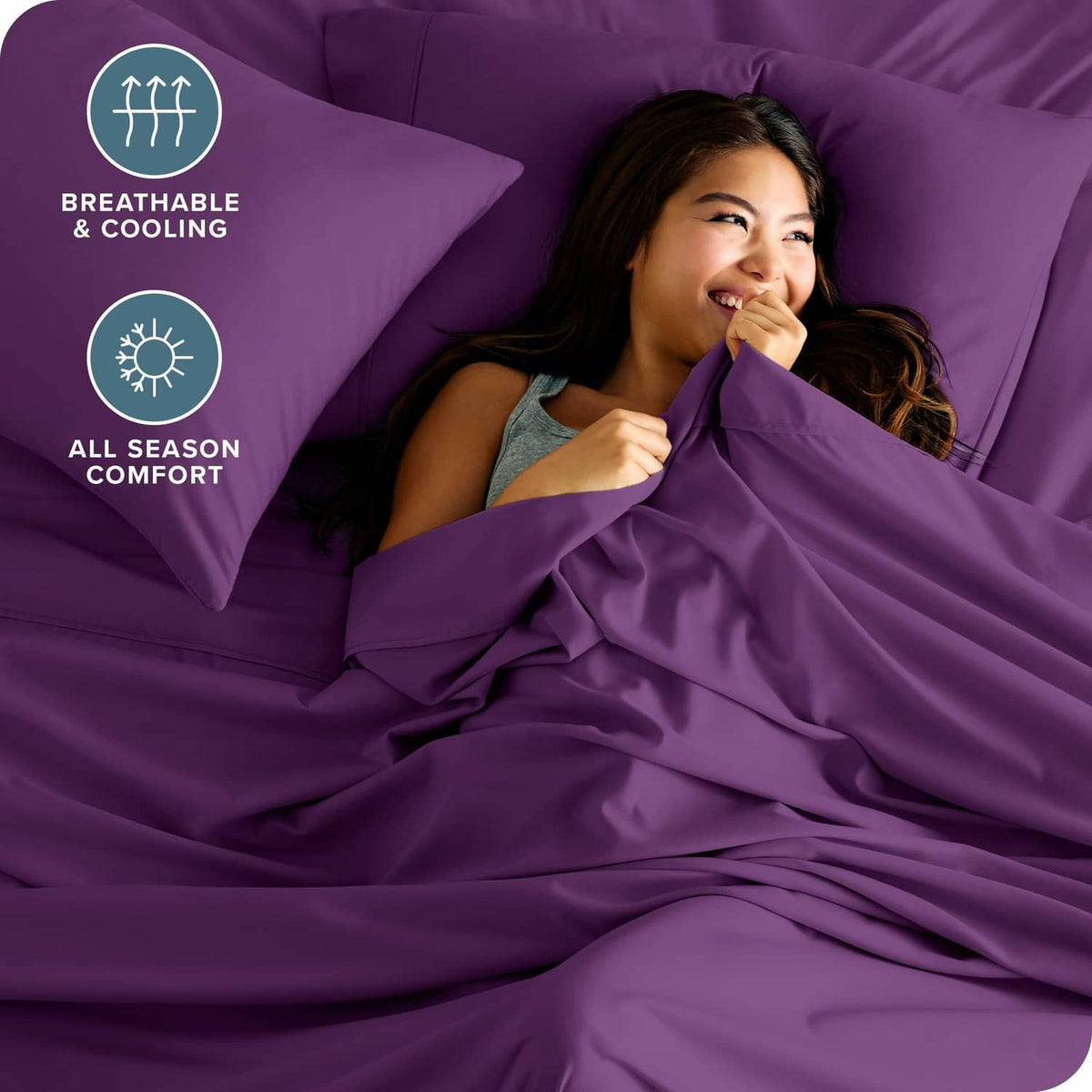 Plum twin bed sheet set with two pillowcases and neatly made flat sheet