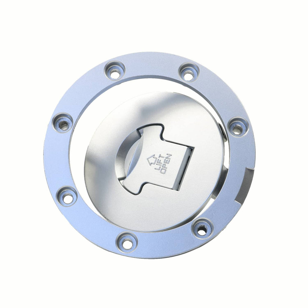 Round silver fuel cap cover with key slot opening and mounting bolt holes