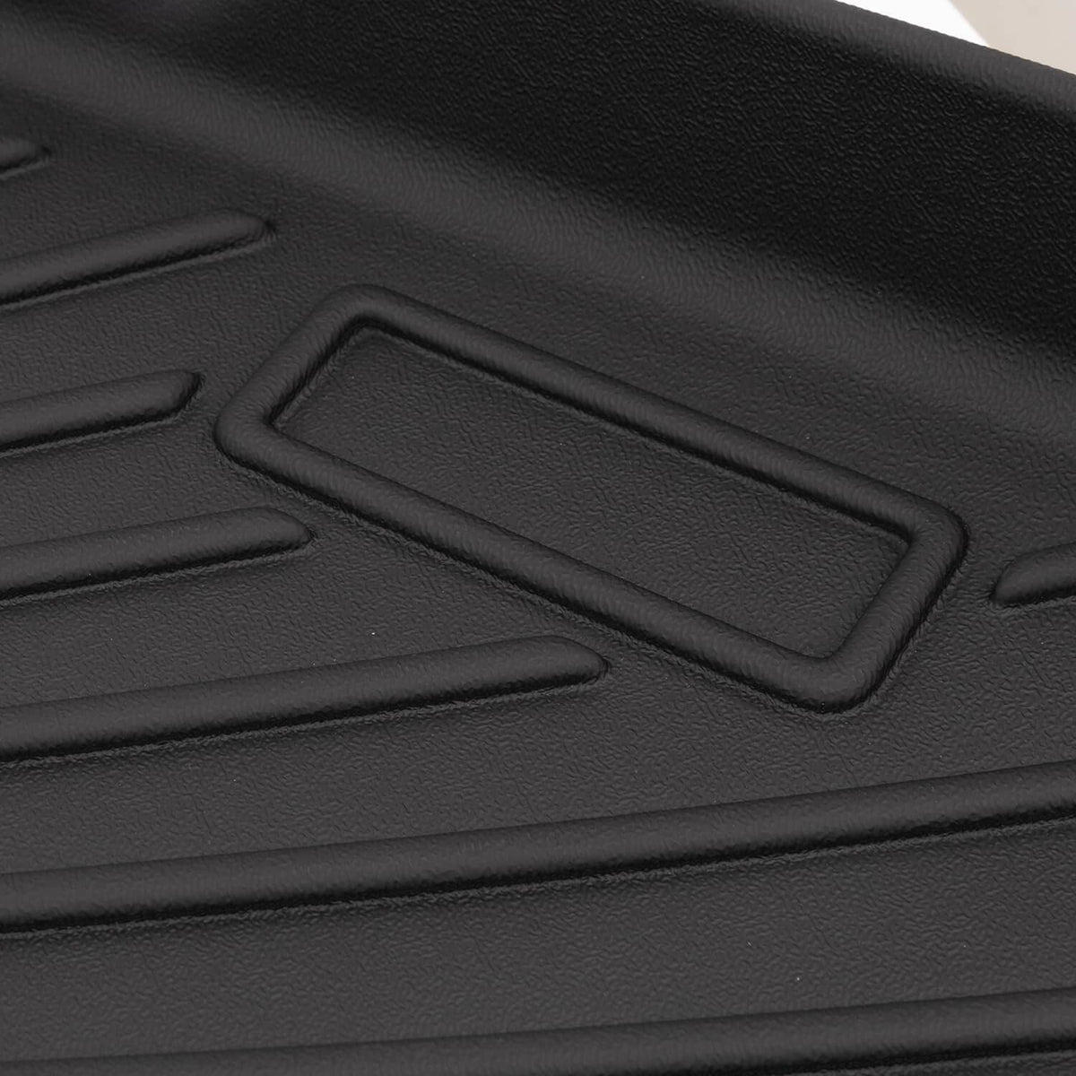 Black TPE floor mat with recessed rectangular slot and anti-slip surface texture.