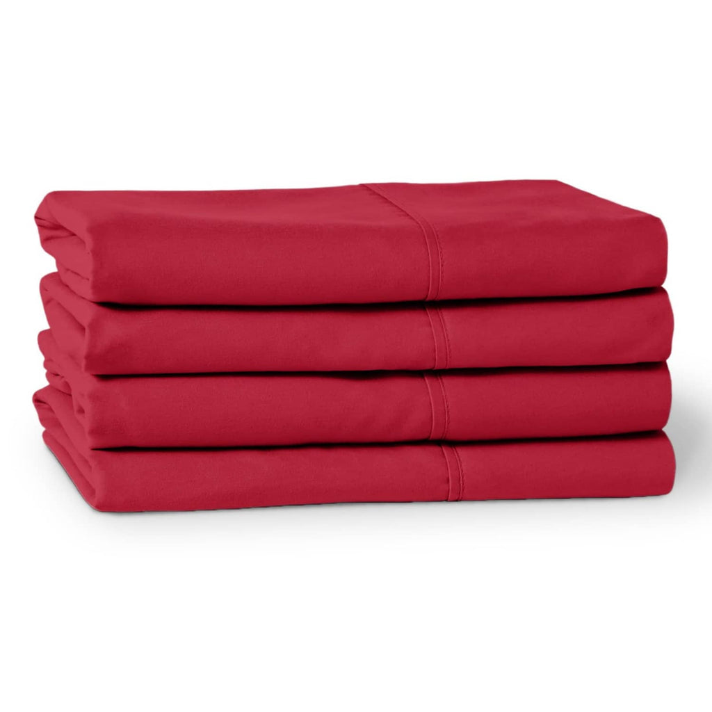 Stack of red microfiber pillowcases folded in a neat, layered set