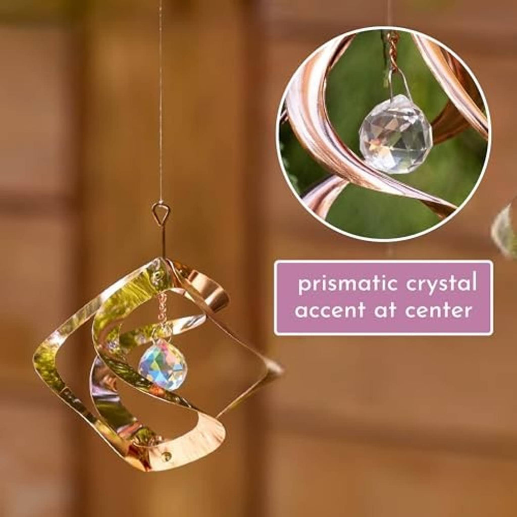 Prismatic copper wind spinner with central crystal accent and dangling crystal charm