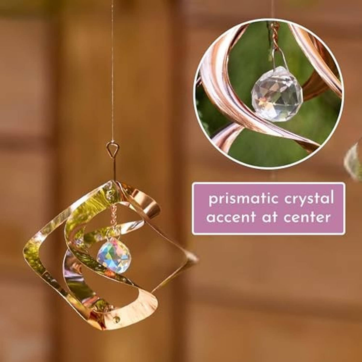 Prismatic copper wind spinner with central crystal accent and dangling crystal charm