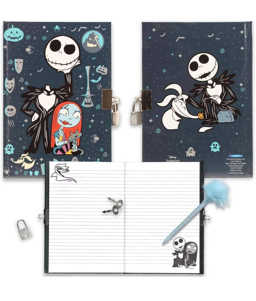 Locked journal diary open with lined pages, two padlocks, and blue pom pen