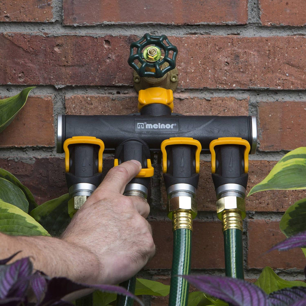 Wall-mounted 4-way lever valve splitter with black housing and yellow lever controls