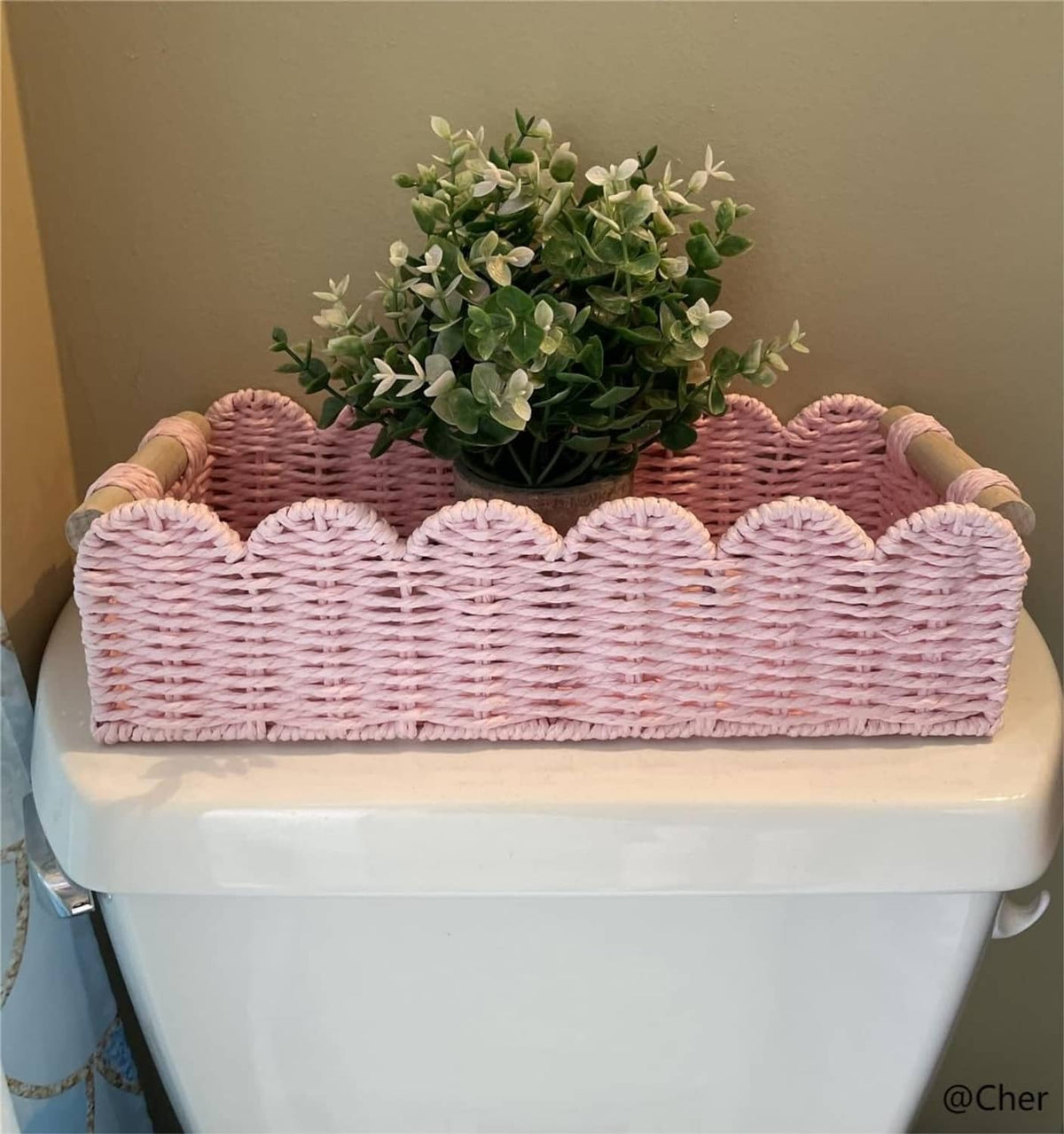 Pink paper rope scalloped edge basket with two handle ends and faux greenery bouquet