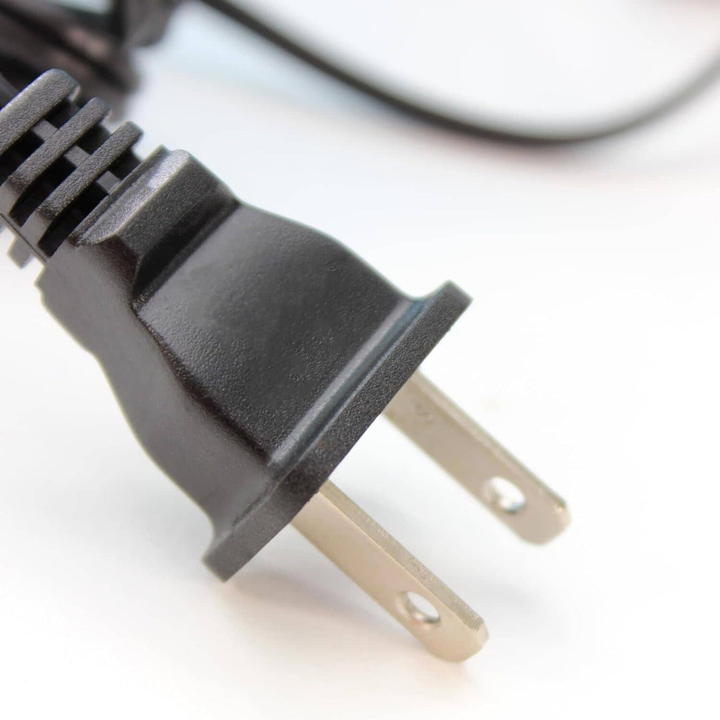 Black power plug with two metal prongs and molded strain relief