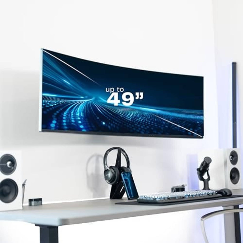 White wall monitor mount holding an ultrawide screen above a desk