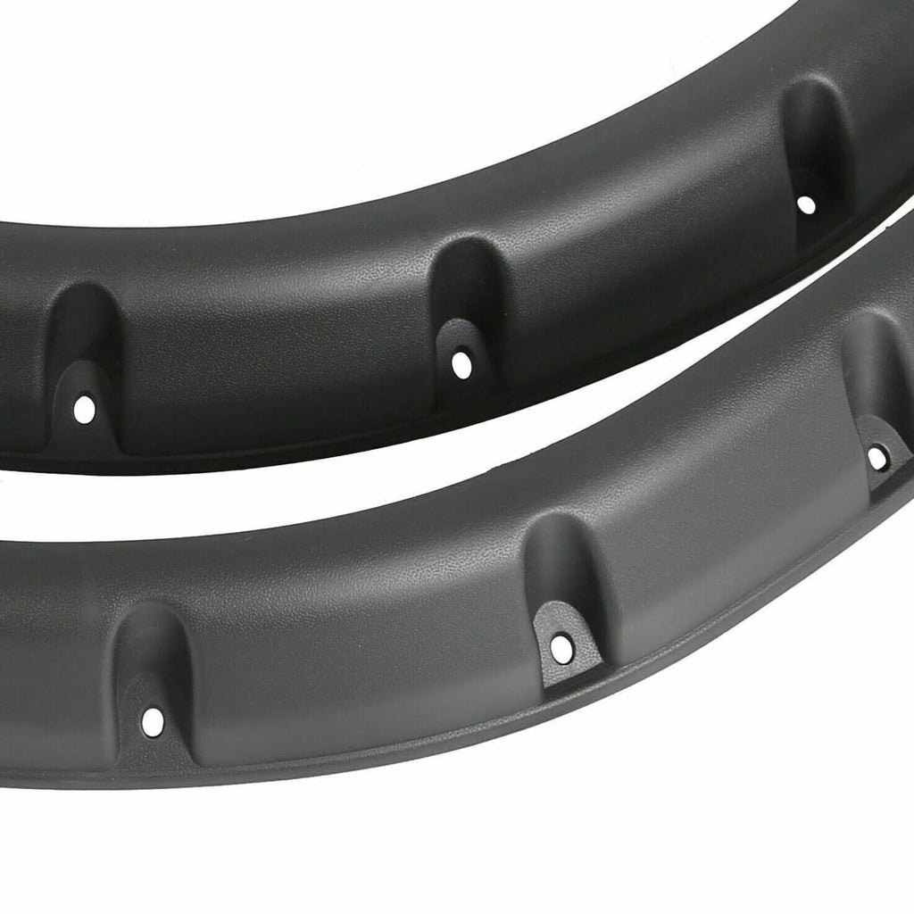 Black plastic fender flare with molded texture and mounting holes