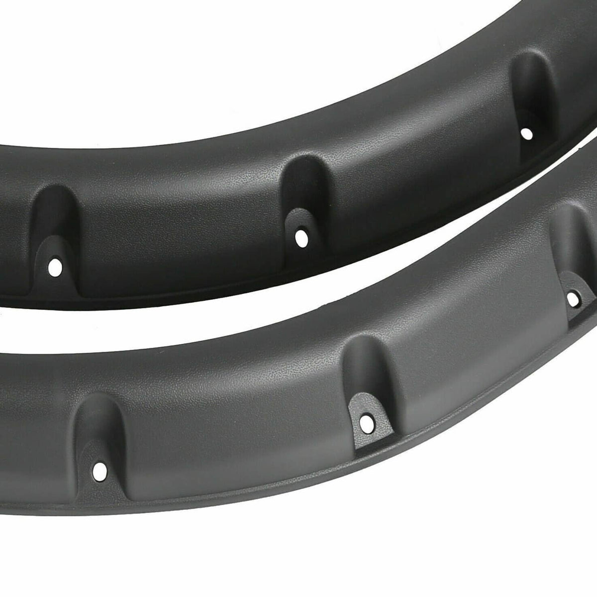 Black plastic fender flare with molded texture and mounting holes