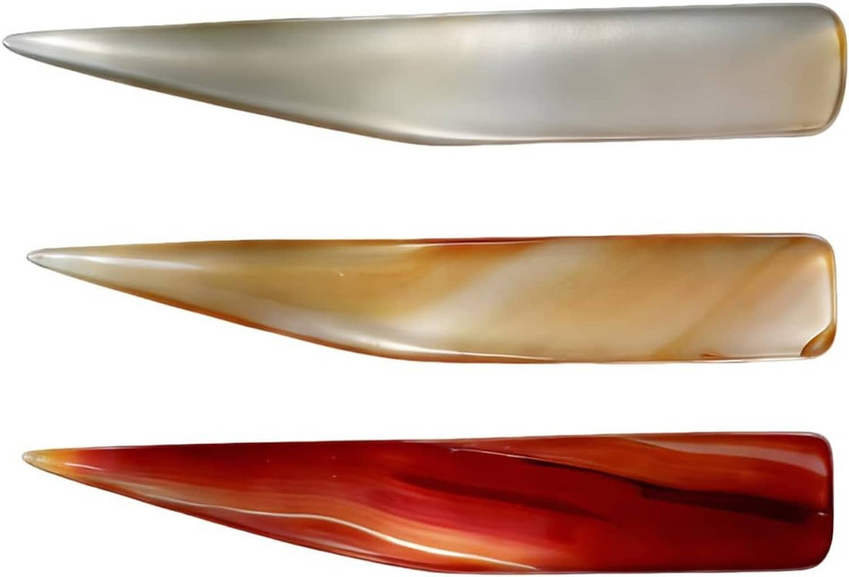 Three agate polishing knives with translucent amber and red banded pointed tips