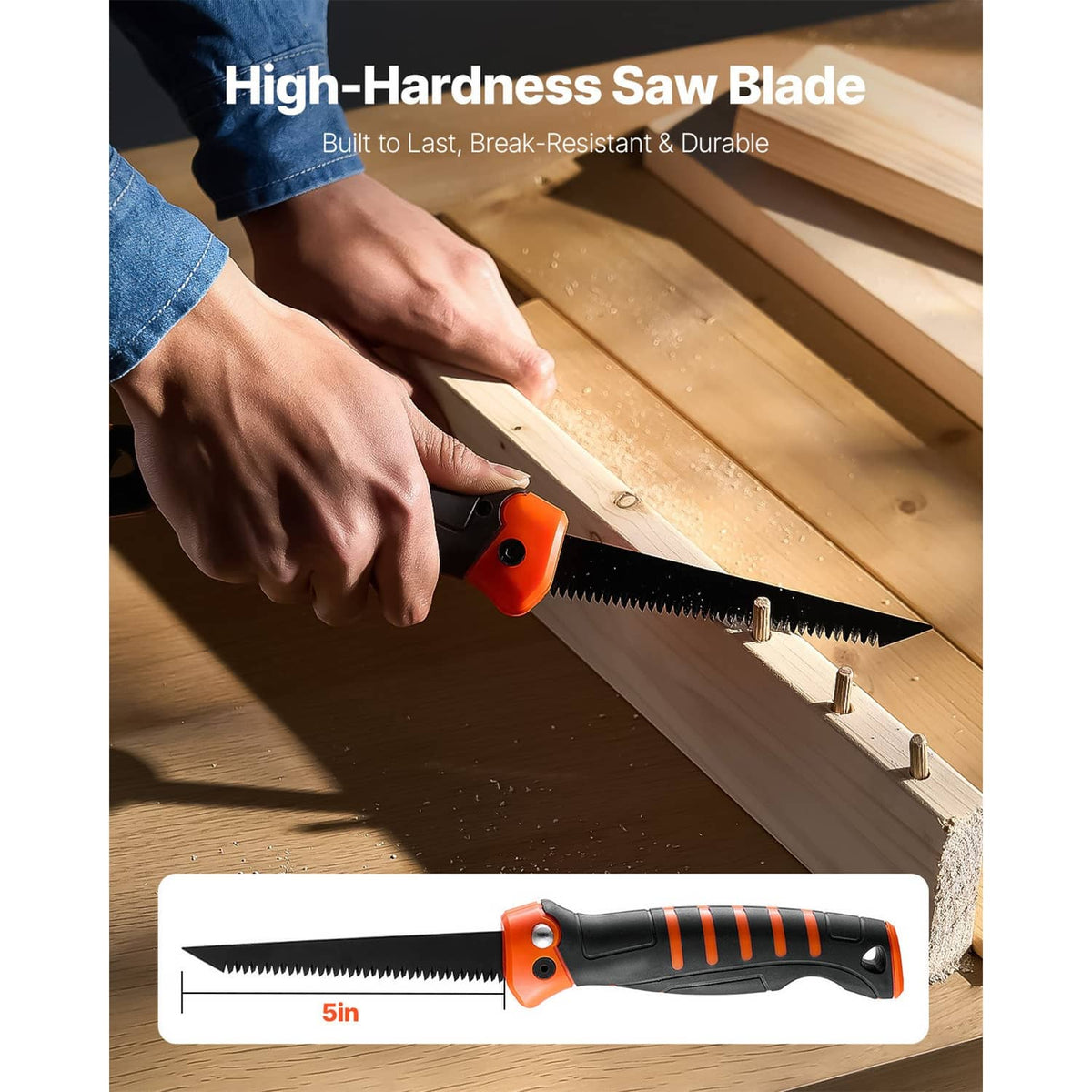 5 in folding hand saw with orange/black handle cutting a wood board