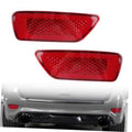 Red rear bumper reflector lamp with textured lens, teardrop shape