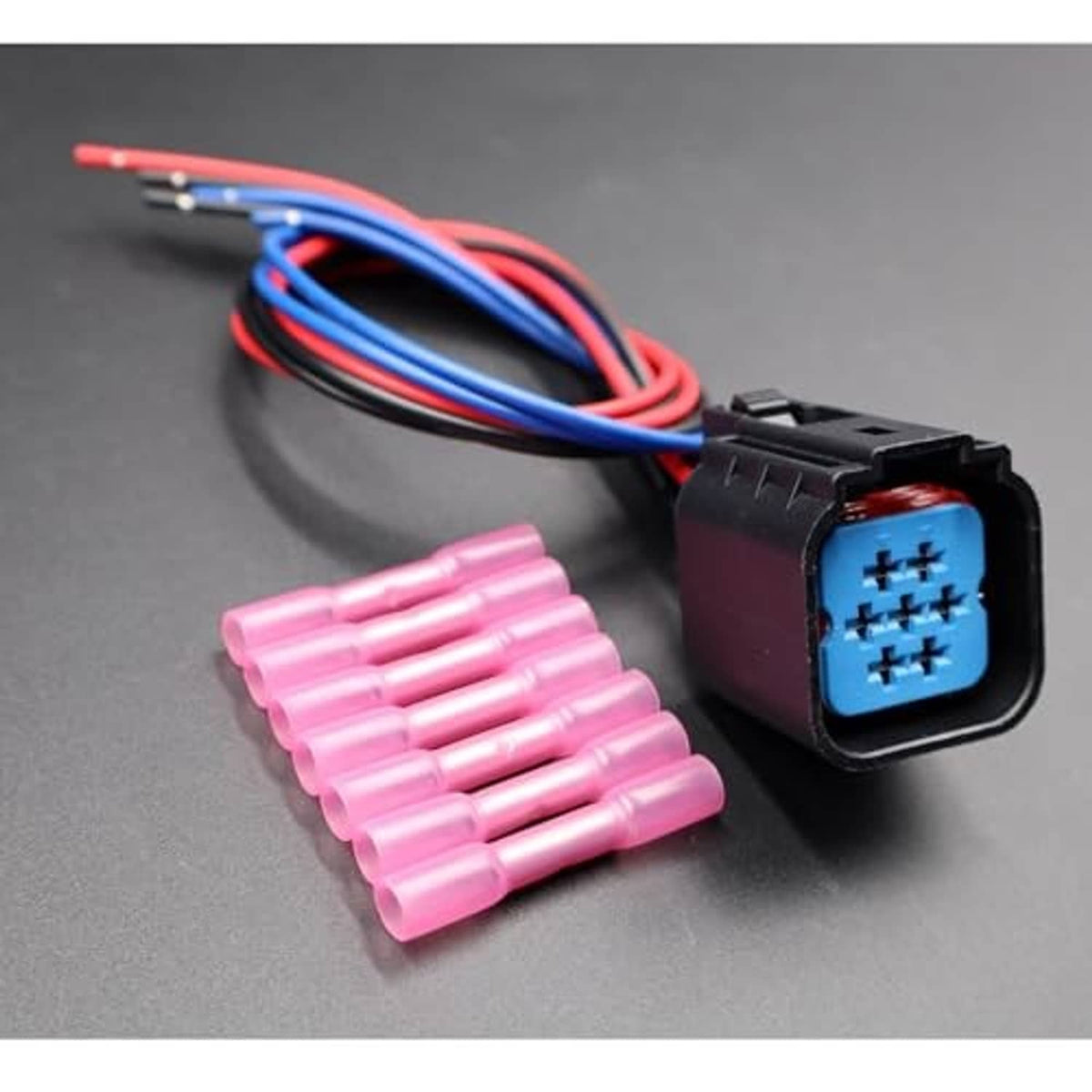 Headlight connector pigtail plug with blue/red wires and pink terminal pins, plus pin strip