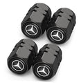Set of 4 black tire valve stem caps with Mercedes-Benz star logo, hex grip design