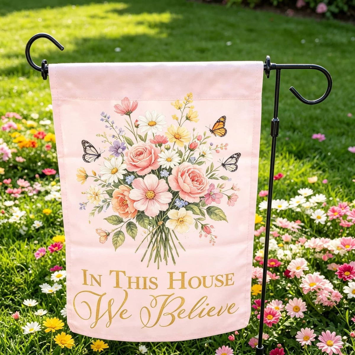Floral garden flag with butterflies and bouquet, reads “In This House I Wye Believe”