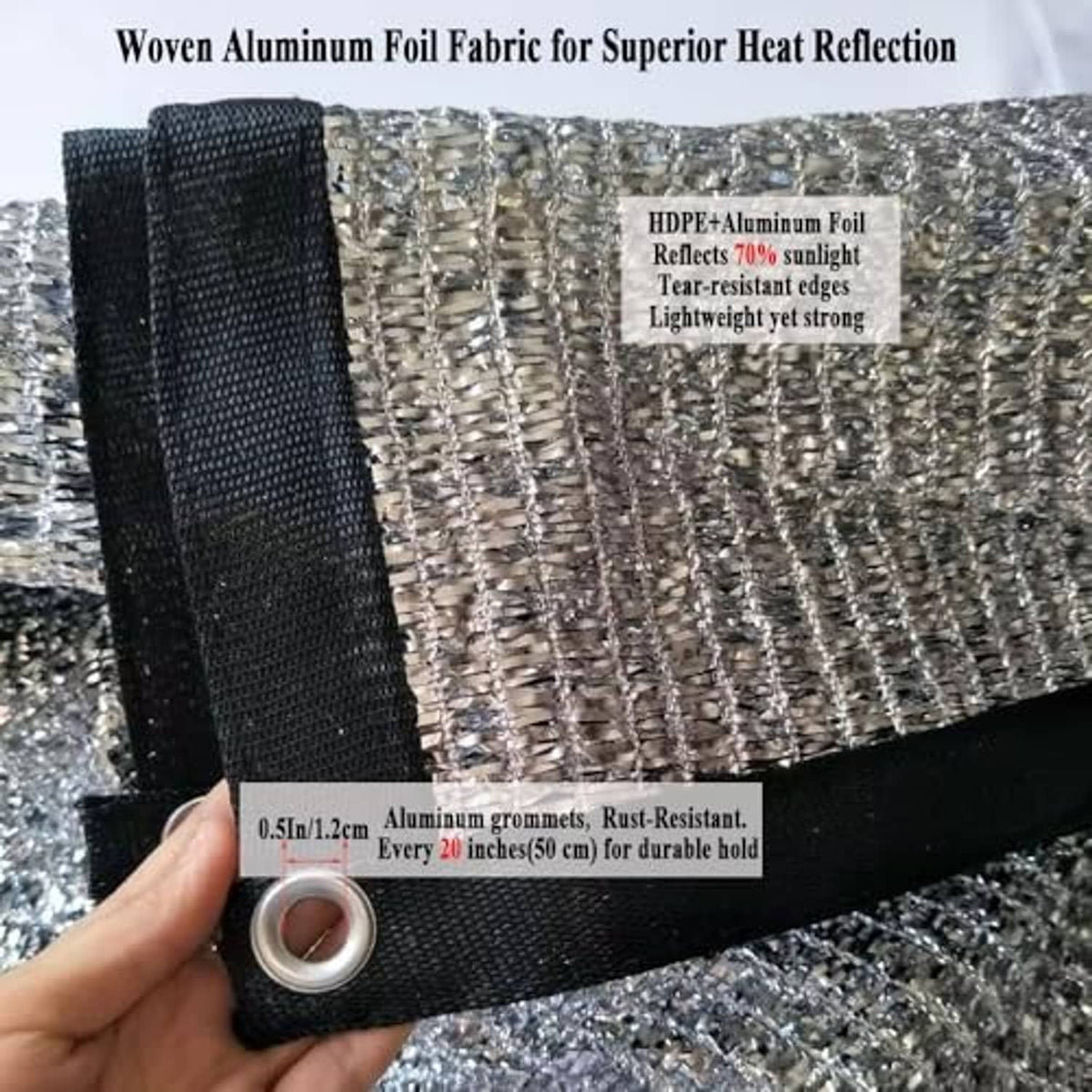 Reflective aluminet shade cloth fabric close-up with aluminum texture and metal grommets