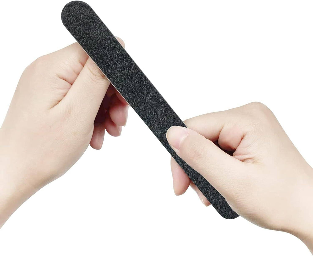 Black double-sided nail file held by hands for nail care.