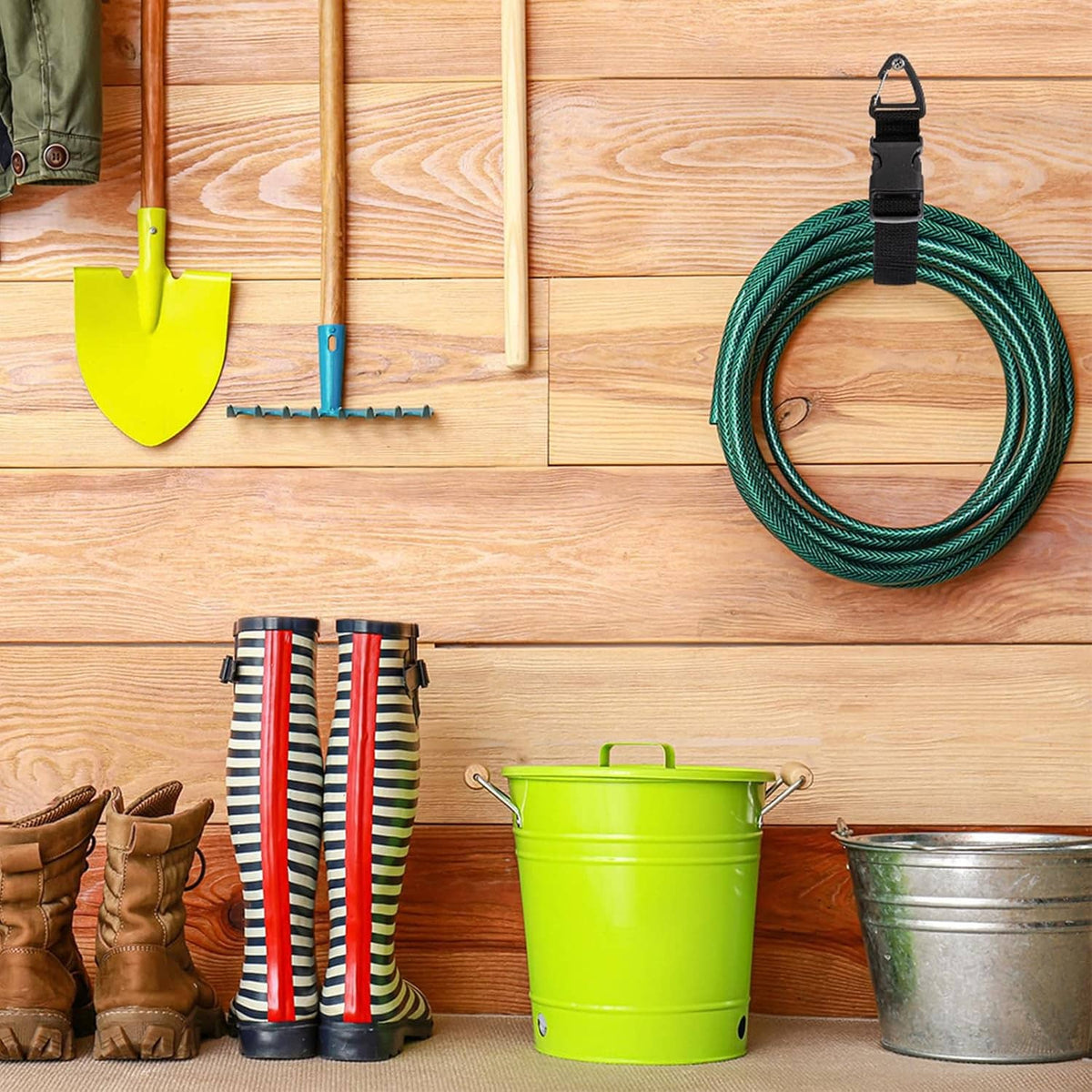 Black cord holder strap securing a green coiled extension cord