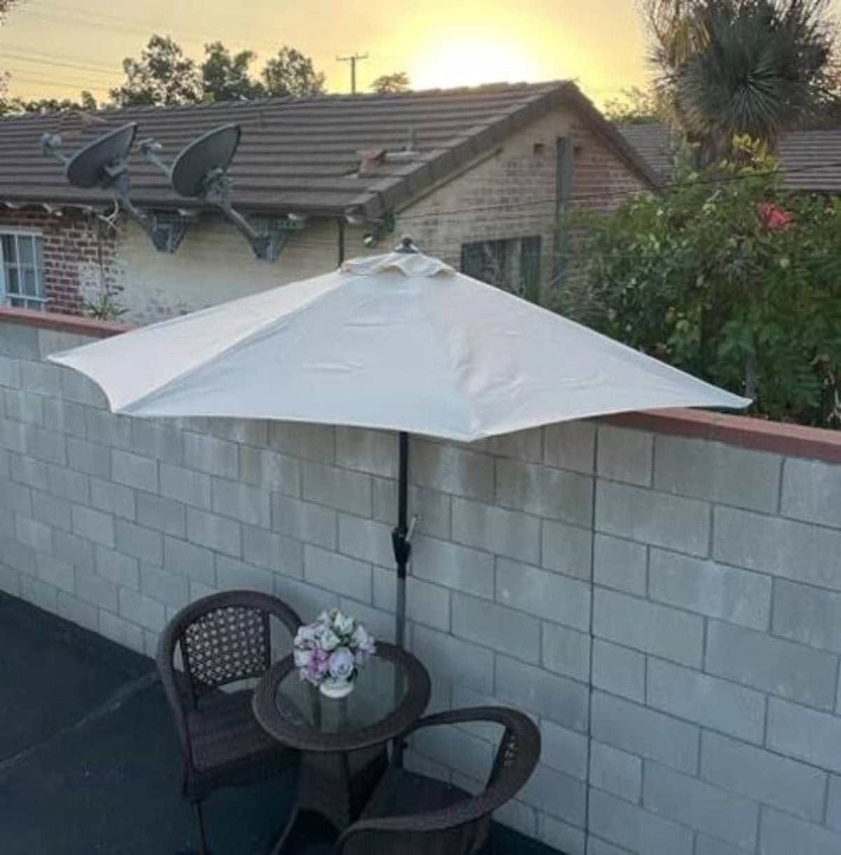 White umbrella canopy with central pole and pleated fabric panels