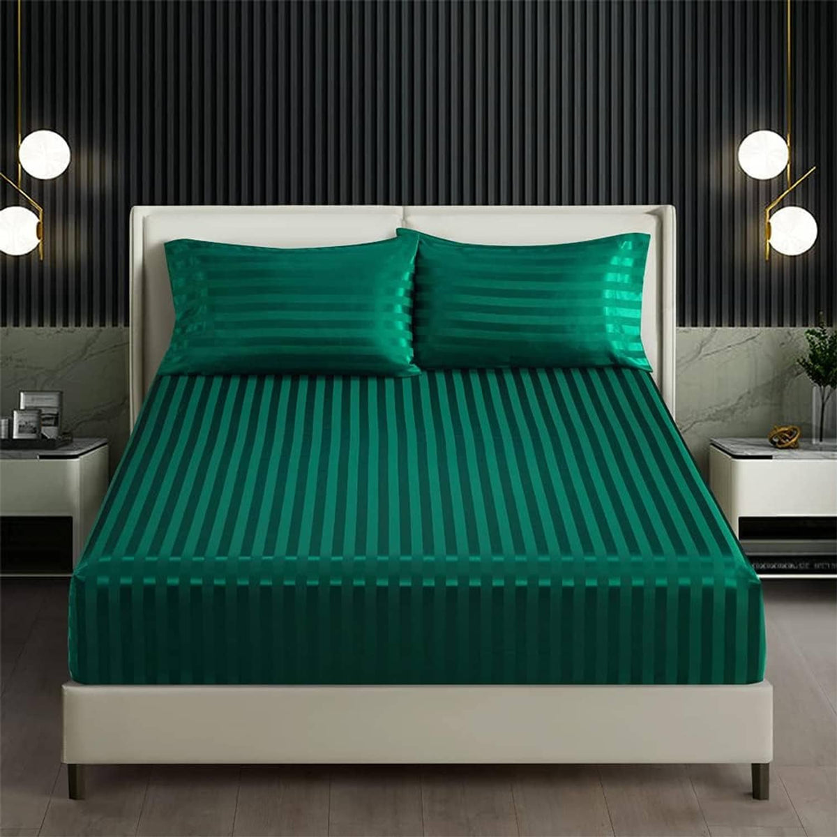 Teal green striped satin fitted sheet and pillowcases on bed, deep pocket look