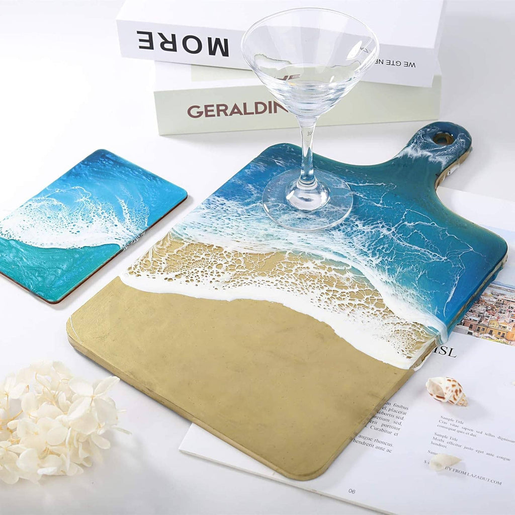 Rectangle silicone tray molds with blue and gold resin river pour, plus stemware
