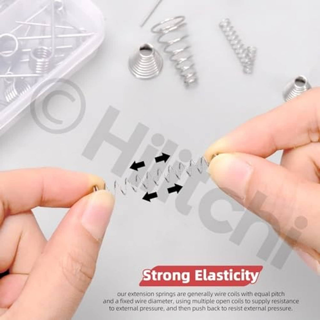 Assorted compressed coil springs showing strong elasticity, with small springs held by hands