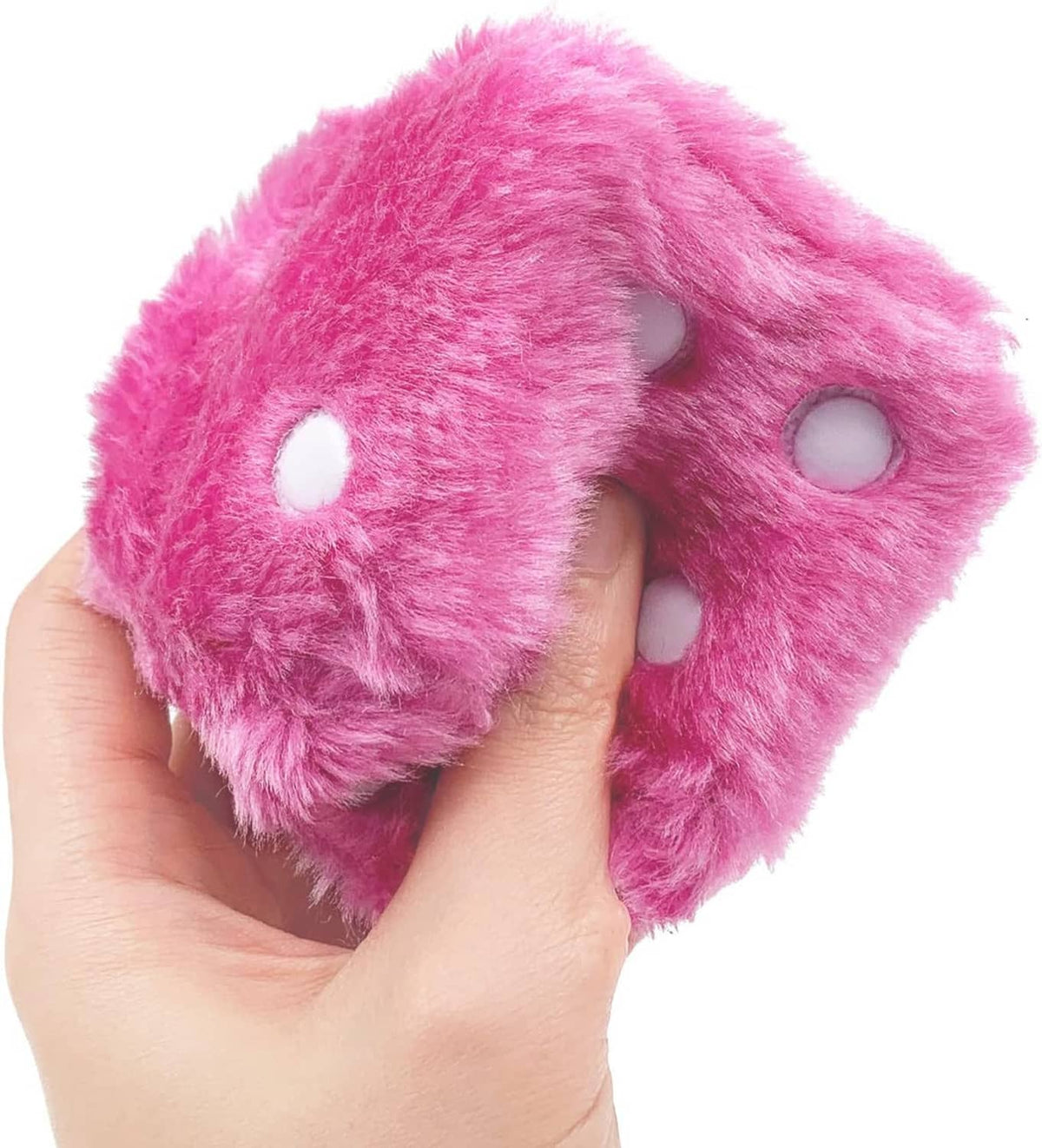 Pink plush dice pair held in hand, fuzzy cubes with white and dark pips