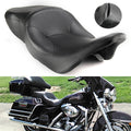 Black passenger motorcycle seat with contoured padding and stitched seams
